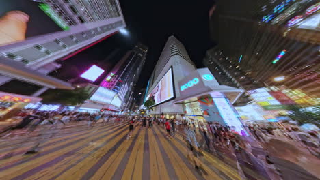 FPV-Hyperlapse-shot-along-the-streets-of-SOGO-in-Causeway-Bay,-Hong-Kong,-China-at-night-time