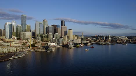 Aerial-view-around-downtown-Seattle-from-the-sea-side,-golden-hour,-in-Washington-state,-USA---circling,-drone-shot