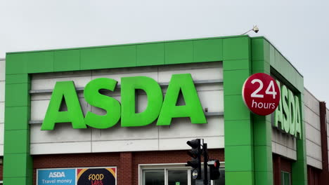 Large-Asda-sign-and-logo-on-exterior-of-supermarket-building-in-city