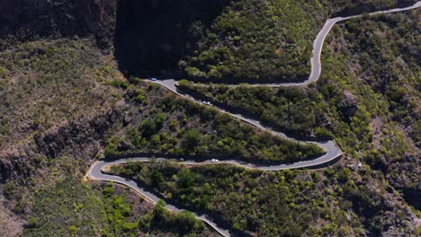 Scenic-winding-mountain-road-going-up-steep-slope-in-Teno-Massif,-aerial