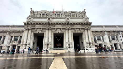 Static-shot-of-Milan-Central-train-station-exterior-building-with-tourists