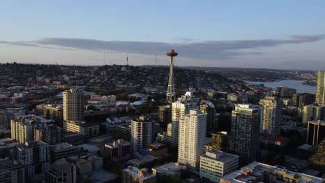 Aerial-view-approaching-the-Space-needle-tower,-sunrise-in-Seattle,-Washington,-USA
