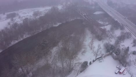 Aerial-view-of-the-Boise-River-in-Idaho-covered-in-snow
