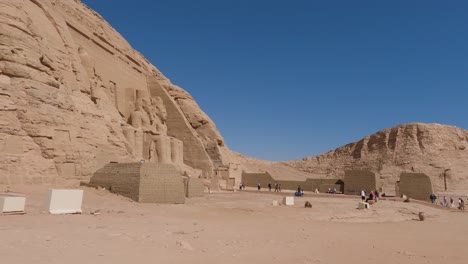 Slow-Pan-Left-Across-Outside-Entrance-To-Abu-Simbel-Temple-In-Egypt