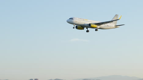 Vueling-Airplane-Flying-On-Clear-Sky-During-Sunset