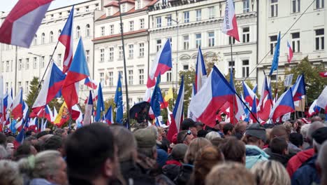 First-person-view-of-demonstrating-crowd-with-czech-flags-in-Prague