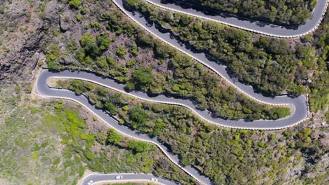 Hairpin-road-going-up-steep-mountain-in-Tenerife,-Teno-Massif,-aerial