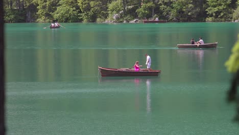 A-woman-changing-her-outfit-on-a-rowing-boat-on-Lake-Braies