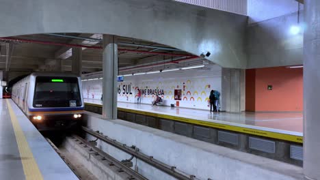 Metro-train-arriving-at-an-indoor-station-in-Brasilia,-Brazil