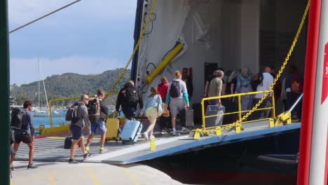 People-Boarding-Ferry-From-Skiathos-Island-Sporades-On-Sunny-September-Day-2022-With-Luggage-Travelling-To-Skopelos-And-Volos