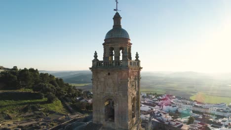 Aerial-ascending-drone-shot-from-the-church-of-santa-maria-with-a-wonderful-view-of-the-historic-old-town-of-medina-sidonia-in-spain-andalucia-in-the-province-of-cadiz-on-a-sunny-day