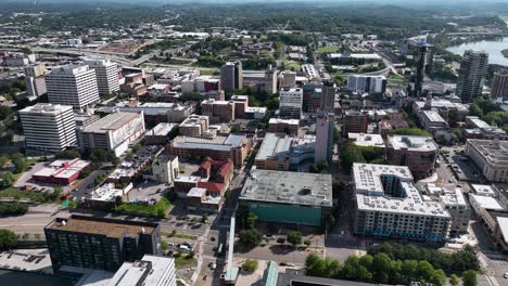Aerial-view-of-downtown-Knoxville,-sunny,-summer-day-in-Tennessee,-USA---rising,-pull-back,-drone-shot