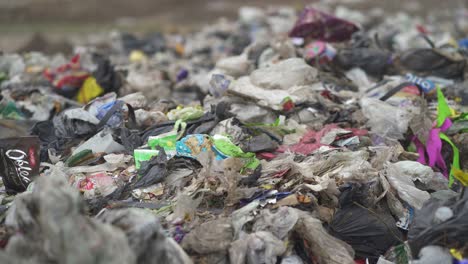 Close-up-of-waste-dumped-in-a-landfill.-Handheld