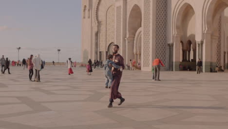 Happy-father-and-child-bonding-in-public-place-nearby-Hassan-II-mosque-in-Casablanca-Mexico