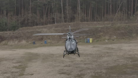 Drone-Aerial-View-of-Police-Helicopter-on-Training-Field,-Special-Force-Combat-Exercise