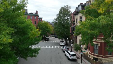 Aerial-approach-towards-old-historic,-colonial-housing-in-Boston,-MA