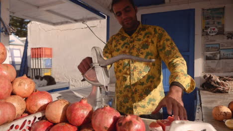 Proud-moroccan-juice-stand-owner-operator-presses-fresh-grapefruit-and-orange-juice