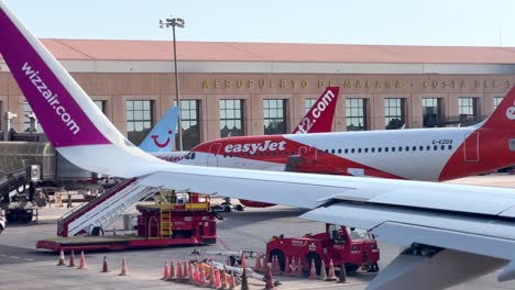 Low-cost-airplanes-and-airlines-lined-up-in-Malaga-airport-in-Spain