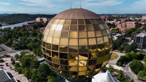 Aerial-view-around-the-reflecting-sphere-on-the-sunsphere-tower,-in-sunny-Knoxville,-USA---circling,-drone-shot