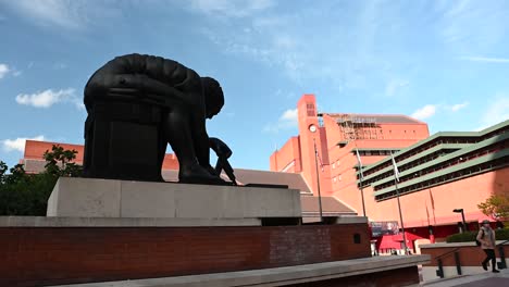 View-of-the-British-Library-behind-the-Issac-Newton-statue-by-Eduardo-Paolozzi,-London,-United-Kingdom