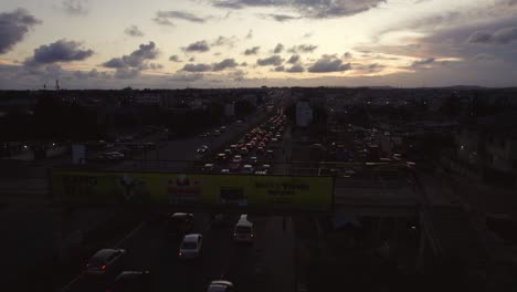 Sunset-Aerial-of-Moving-Vehicle-Traffic-on-Highway-Accra-Ghana