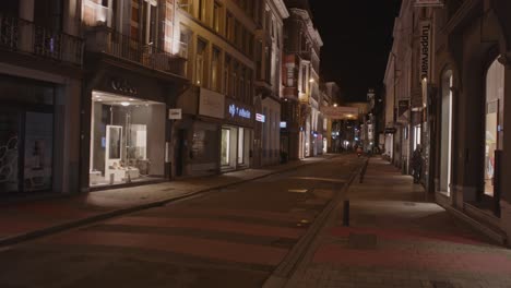 static-view-of-shopping-district-in-Ghent,-Belgium-at-night