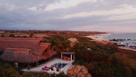 Rich-couple-watches-from-their-luxury-rental-villa-in-Oaxaca-Mexico-as-sun-sets