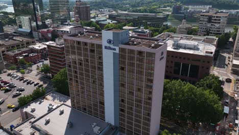 Aerial-view-towards-the-Hilton-hotel-logo,-sunny-day-in-downtown-Knoxville,-USA