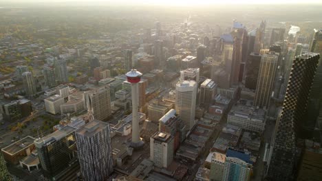 Aerial-view-around-the-Calgary-tower,-during-golden-hour,-fall-morning-in-Alberta,-Canada---circling,-drone-shot