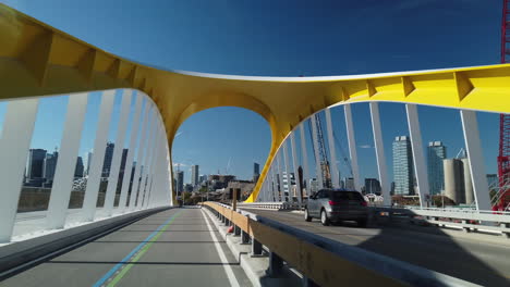 Wide-exterior-travelling-shot-cycling-across-the-new-Cherry-Street-South-bridge