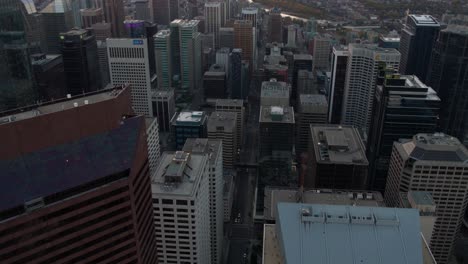 Aerial-view-overlooking-skyscrapers-in-downtown-Calgary,-autumn-evening-in-Alberta,-Canada