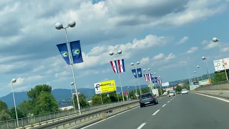 Entering-capital-city-of-Croatia-Zagreb-trough-Jankomir-bridge-from-Car,-hanheld-shoot