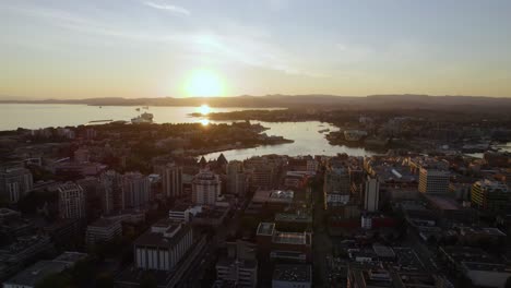 Aerial-view-over-the-cityscape-of-Victoria-West,-sunset-in-BC,-Canada---reverse,-drone-shot