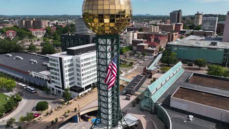 Independence-day-flag-on-the-Sunsphere-tower-in-Knoxville,-USA---Aerial-view