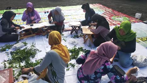 a-number-of-women-make-eco-friendly-batik,-ecoprint