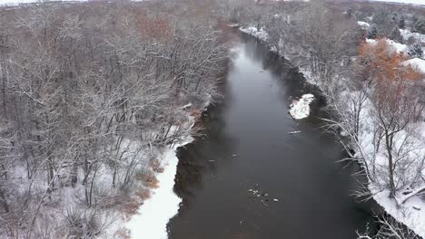 Rising-aerial-view-of-the-Boise-River-in-Idaho-with-snow-covering-the-land
