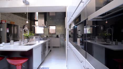 Clean-bright-modern-design-kitchen-space-Gimbal-shot-tracking-backwards