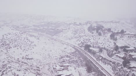 Aerial-view-of-a-highway-covered-in-snow-near-Boise,-Idaho