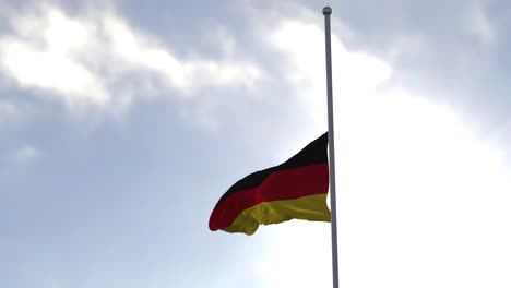 Flag-of-Germany-half-mast-in-the-wind