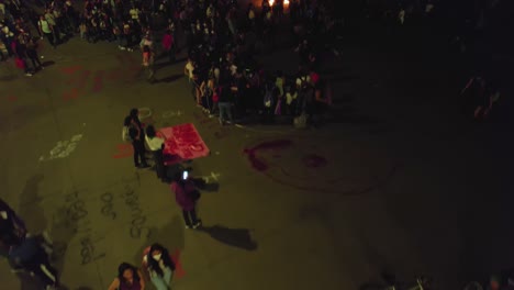 People-camping-at-a-large-square,-during-riots-in-Mexico-city---aerial-view