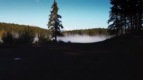 Lake-with-mist-steaming-approached-from-shore-Enid-British-Columbia-Canada