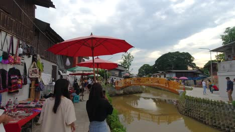 Many-young-people-gather-at-new-sightseeing-spot-in-Chiang-Mai,-Khlong-mae-Kha-Canal