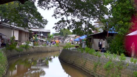 Slow-motion-reveal-of-Klong-Mae-Kha-Canal-in-Chiang-Mai,-a-new-tourist-destination