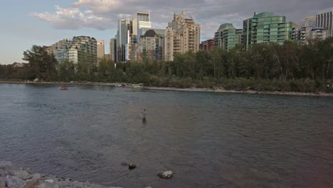 Fisherman-Bow-river-in-city-with-skyscrapers-sunset-Calgary-Alberta-Canada