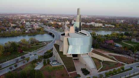 Aerial-view-around-the-Canadian-Museum-for-Human-Rights,-sunny,-fall-morning-in-Winnipeg,-Canada---circling,-drone-shot