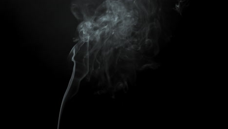 smoke-comes-from-bottom-in-background-black-closeup-view