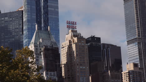 Panoramic-View-of-Essex-House-Hotel-Building-Surrounded-by-Modern-Architecture-Tall-Towers-in-Downtown,-New-York-City-Manhattan-Usa,-Urban-Cityscape-and-Tourism