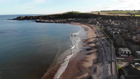 Rising-away-drone-shot-of-Stonehaven-in-Scotland,-UK