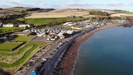 Flying-along-the-beach-at-Stonehaven-in-Scotland,-UK