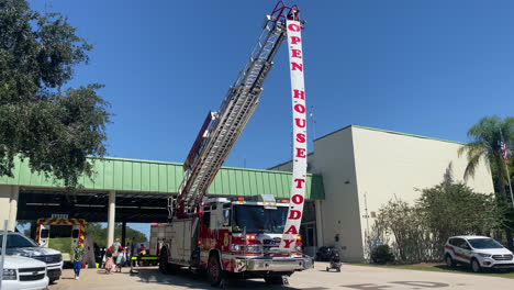 Fire-Truck-Presented-at-Open-House-Public-Exhibition-Presentation-at-Temple-Terrace-Fire-Station-Florida,-People-Visitors-Discovering-the-Firefighting-Vehicle-Equipment